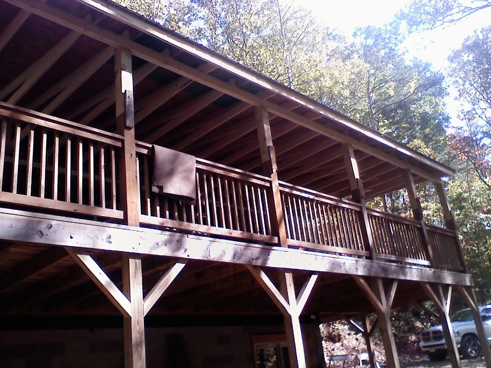 Timber framing under a new elevated porch and deck — Roof Leak Repair in Schneider by Roofing Brothers